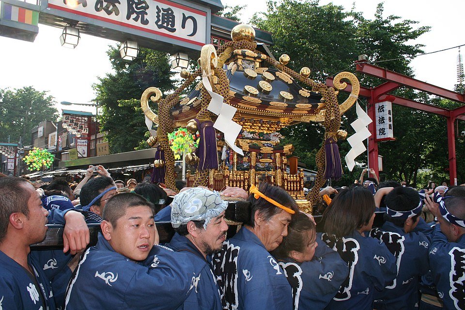 View of Asakusa Shrine's hall from within the Sensoji Temple grounds, showing the close proximity of the two historic sites