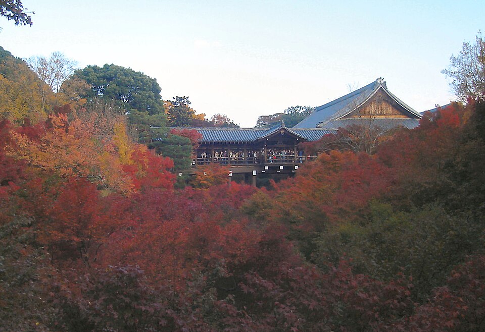 Autumn foliage of Sengyokukan viewed from atop Tsutenkyo Bridge, red and orange maples filling the ravine
